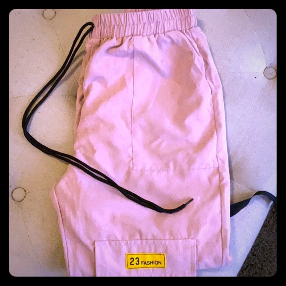 Pink joggers, it has pockets. Drawstrings